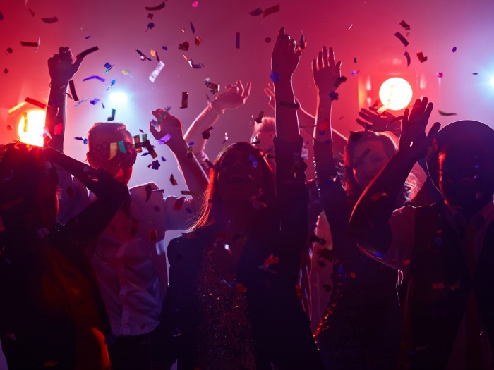 young people dancing in night club